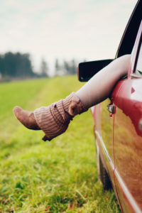 Car window, woman's leg, detail Car window, woman's leg, detail